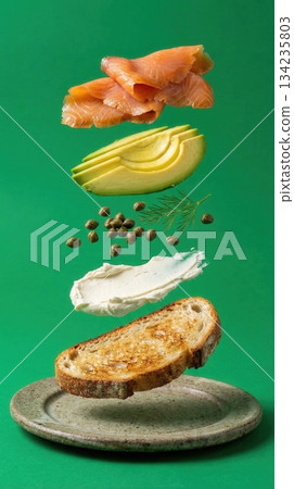 Deconstructed Salmon And Avocado Toast Ingredients green background Deconstructed Salmon And Avocado Toast Ingredients green background 134235803