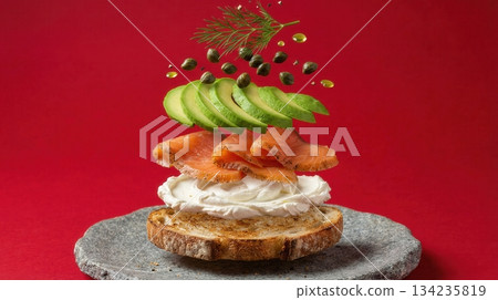 Deconstructed Salmon And Avocado Toast Ingredients red background Deconstructed Salmon And Avocado Toast Ingredients red background 134235819