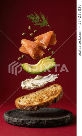 Deconstructed Salmon And Avocado Toast Ingredients red background 134235836