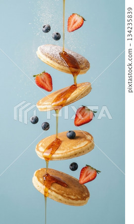 Flying Stack Of Pancakes With Berries And Honey Syrup Art 134235839