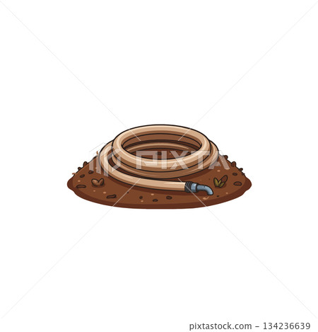Coiled garden hose on a pile of soil evokes summer gardening with watering tool on ground 134236639