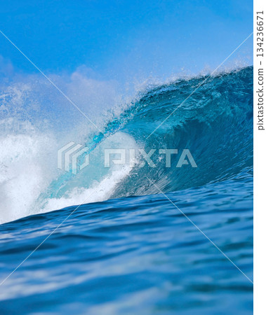 Majestic ocean swell with shimmering sunlight and foamy crest Majestic ocean swell with shimmering sunlight and foamy crest 134236671