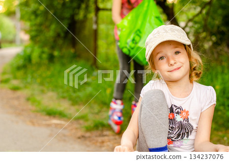 Little girl with a tricycle in the park 134237076