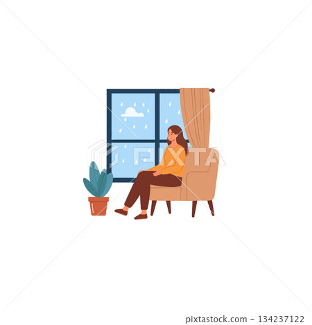 Solitude and comfort: A woman embraces rainy day tranquility in her serene sanctuary at home 134237122