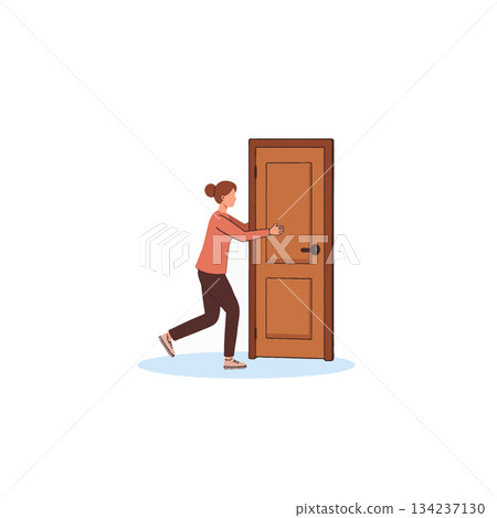 Young woman approaching a sturdy wooden door expressing curiosity in an open space minimalist 134237130