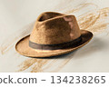 Stylish Fedora Hat Resting on Surface With Artistic Background Details Generative AI 134238265