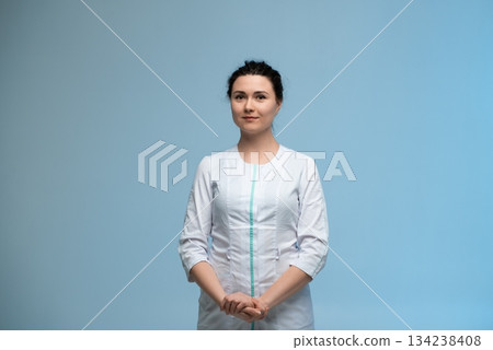 Confident female doctor in medical uniform with stethoscope, professional healthcare portrait 134238408