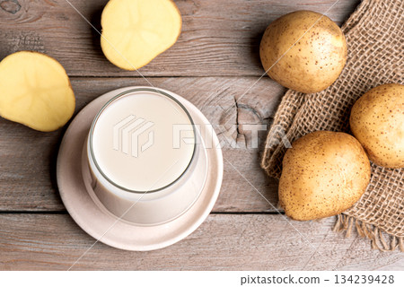 Vegan potato milk on wooden background 134239428