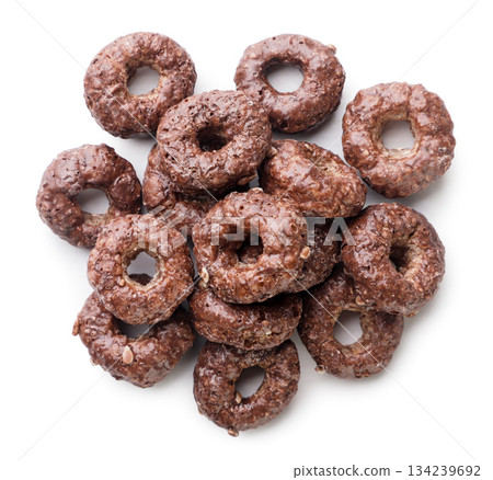 Pile of chocolate corn rings on a white background. Top view 134239692