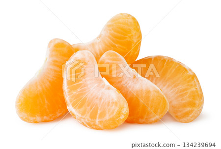 Pile of tangerine slices close-up on a white background. Isolated 134239694