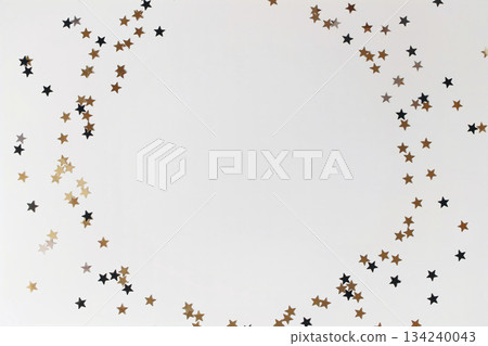 Metallic gold, silver black star confetti circle isolated on white background. Festive celebration round frame. Birthday party decoration border. Holiday New Year composition, copyspace, flatlay, top Metallic gold, silver black star confetti circle isolated on white background. Festive celebration round frame. Birthday party decoration border. Holiday New Year composition, copyspace, flatlay, top 134240043