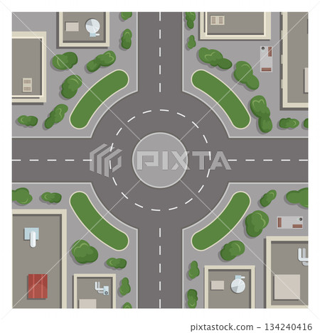 A city street with a round intersection and a green median 134240416