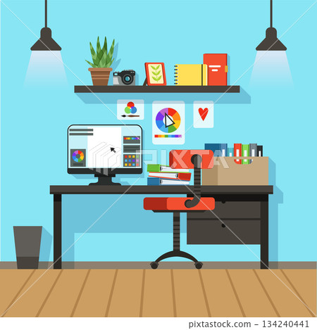 A computer desk with a red chair and a computer monitor A computer desk with a red chair and a computer monitor 134240441