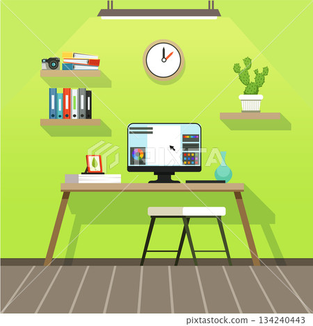 A computer desk with a computer monitor and a clock on the wall A computer desk with a computer monitor and a clock on the wall 134240443