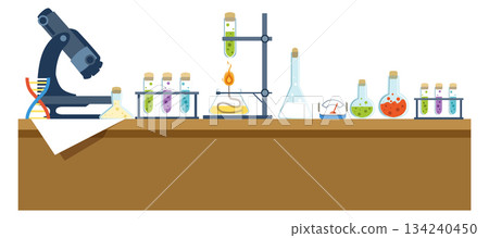 A lab table with many different colored bottles and beakers A lab table with many different colored bottles and beakers 134240450