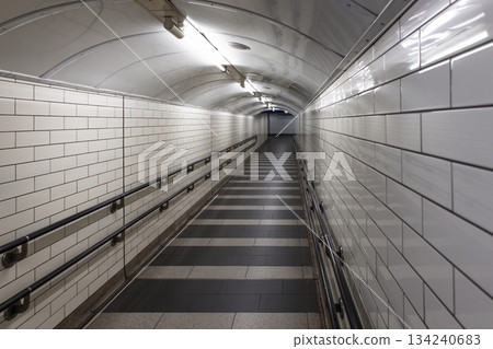 Empty Underground Subway Tunnel with White Tiles Empty Underground Subway Tunnel with White Tiles 134240683