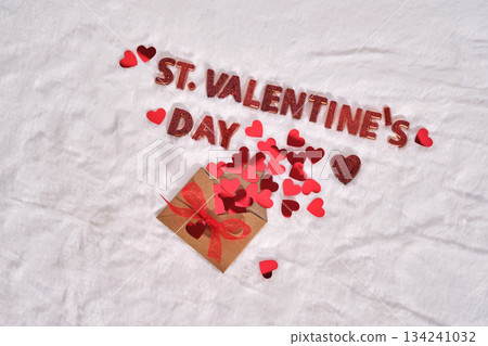 Festive St. Valentine's Day background on a white plush background with hearts. Festive St. Valentine's Day background on a white plush background with hearts. 134241032