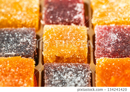 A close up of a tray of assorted marmalade colored candies A close up of a tray of assorted marmalade colored candies 134241420