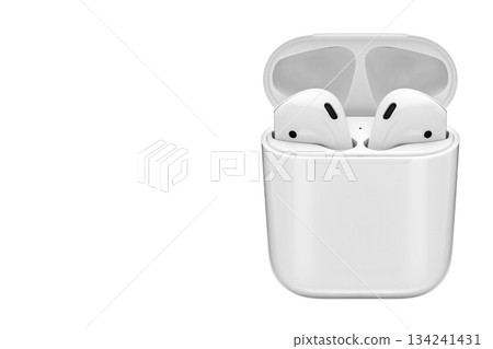 A pair of white earbuds are sitting on a white background A pair of white earbuds are sitting on a white background 134241431