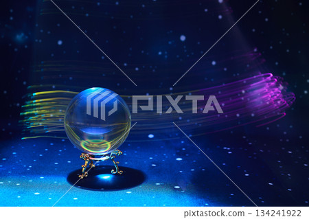 Magical Orb in Space. A glowing orb rests on an ornate stand, surrounded by cosmic light streaks Magical Orb in Space. A glowing orb rests on an ornate stand, surrounded by cosmic light streaks 134241922