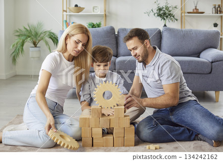 Parents And Son Playing With Wooden Toys Enjoying Family Time At Home Parents And Son Playing With Wooden Toys Enjoying Family Time At Home 134242162
