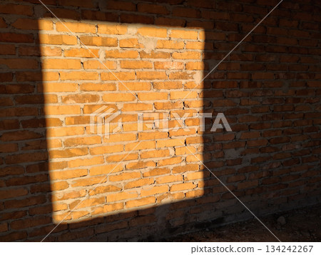 The rays of the setting sun passed through the square window The rays of the setting sun passed through the square window 134242267