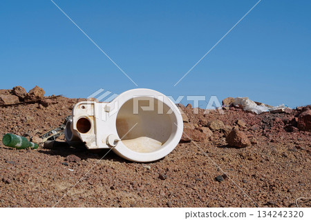 Toilet sink lies in desert, abuse of environment Toilet sink lies in desert, abuse of environment 134242320