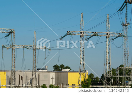 Power transmission towers near electric station 134242343