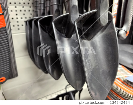 Shovels lined up for gardening tasks in a home improvement store 134242454