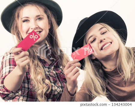 Two woman after sale shopping 134243004