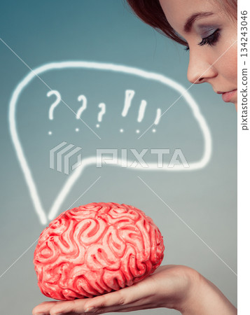 Woman hand holding brain Woman hand holding brain 134243046