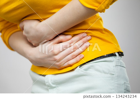 Woman suffer from belly pain. 134243234