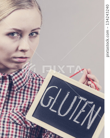 Woman holding board with gluten sign Woman holding board with gluten sign 134243240
