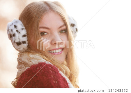 Pretty gorgeous woman in earmuffs. Pretty gorgeous woman in earmuffs. 134243352