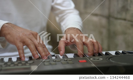 Hands On Keyboard Musicians Performance With White Keys, Business In Background 134244468