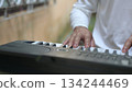 Black And White Keyboard Close Up Persons Hand Plays Electronic Synthesizer Keys, Soft Background 134244469