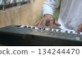 White Keyboard Keys Under Hand Composers Devotion To Music, Forming Trio Quartet On White Background 134244470