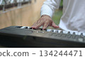 Close Up Hands Serene Music Performance On Black Keyboard, White Keys, For Relaxation 134244471