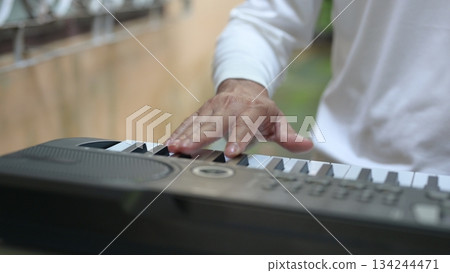 Close Up Hands Serene Music Performance On Black Keyboard, White Keys, For Relaxation Close Up Hands Serene Music Performance On Black Keyboard, White Keys, For Relaxation 134244471