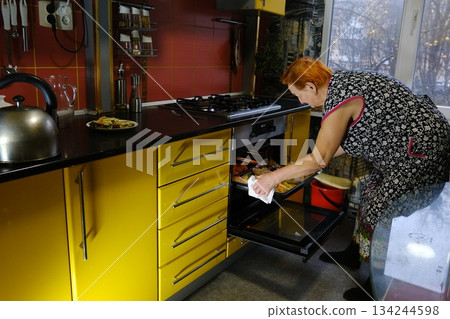Mature woman, kitchen and cellphone for recipe, cooking and read for instructions online. Vegan, fruit and diet for health food in home, female person and internet for breakfast meal in retirement 134244598
