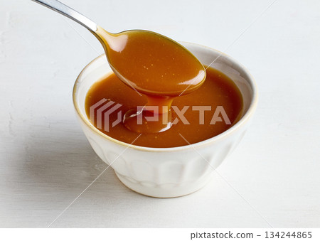 bowl of freshly cooked homemade caramel sauce bowl of freshly cooked homemade caramel sauce 134244865