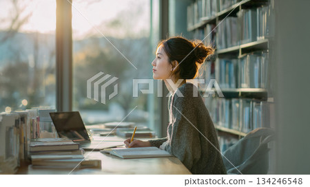 Adult woman studying in the library Adult woman studying in the library 134246548