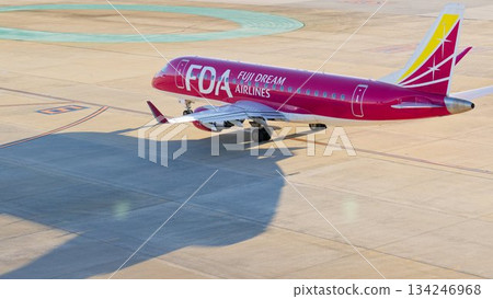 Fuji Dream Airlines (FDA) Embraer 175 passenger aircraft waiting for takeoff 134246968