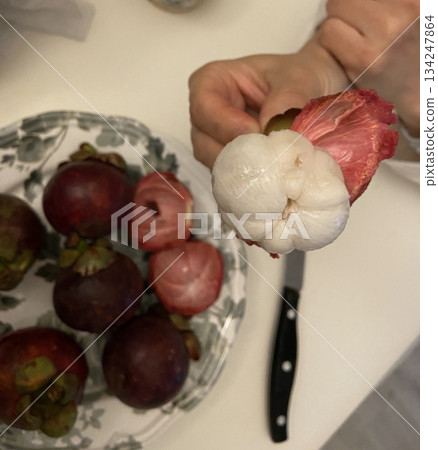 Fresh mangosteen with its thick purple rind and juicy, sweet white segments. Known as the queen of fruits, it delivers a unique blend of tart and sweet flavors. Fresh mangosteen with its thick purple rind and juicy, sweet white segments. Known as the queen of fruits, it delivers a unique blend of tart and sweet flavors. 134247864