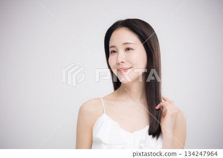 Beauty portrait, woman with beautiful hair taking care of her long straight hair 134247964