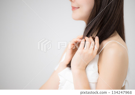 Beauty portrait, woman with beautiful hair taking care of her long straight hair Beauty portrait, woman with beautiful hair taking care of her long straight hair 134247968