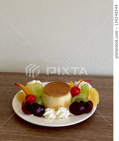 Smooth and creamy pudding with a velvety texture, offering a sweet and satisfying flavor. Perfect as a simple dessert or a refreshing treat for any occasion. 134248544