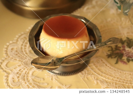 Smooth and creamy pudding with a velvety texture, offering a sweet and satisfying flavor. Perfect as a simple dessert or a refreshing treat for any occasion. 134248545