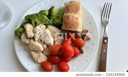 Fresh vegetable salad with a vibrant mix of greens, cherry tomatoes, cucumbers, and bell peppers. Crisp, colorful, and packed with vitamins, this salad makes a healthy, delicious meal or side. 134248900