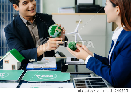 Business team people planning hand using laptop for working technology and business Net zero and carbon neutral concept. 134249735